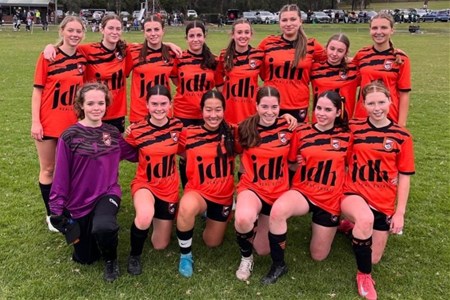 a group of people posing for a photo