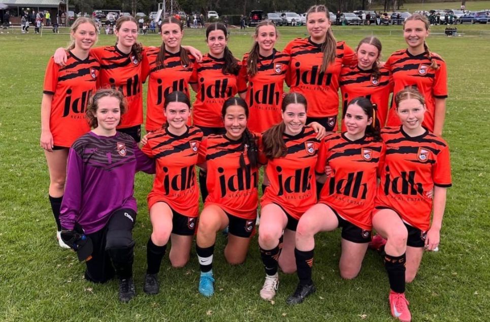 a group of people posing for a photo