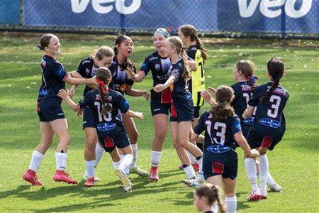 a group of people playing football on a field