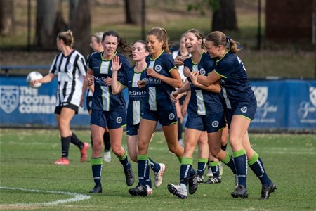 a group of young men playing a game of football