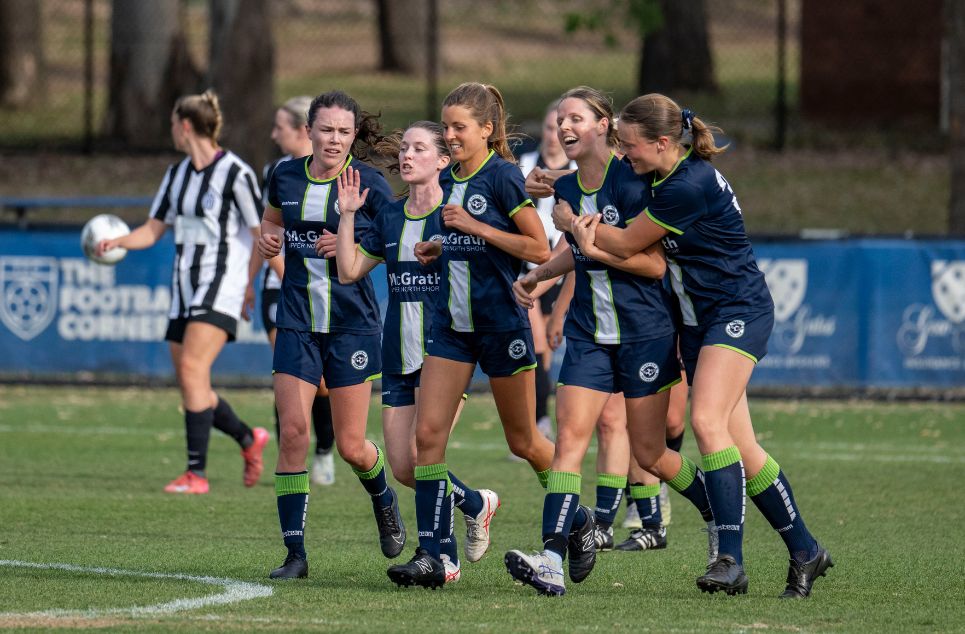a group of young men playing a game of football