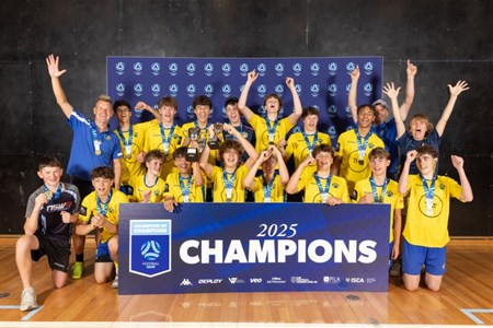 a group of people standing in front of a crowd posing for the camera