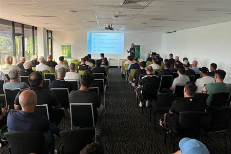 a group of people sitting at a table in a room