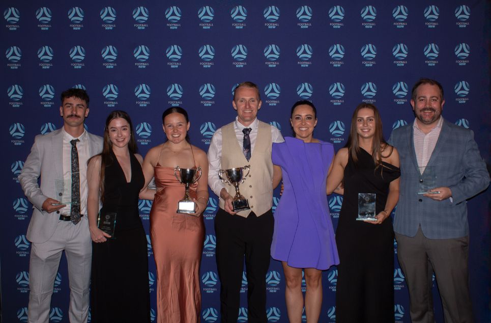 a group of people posing for a photo