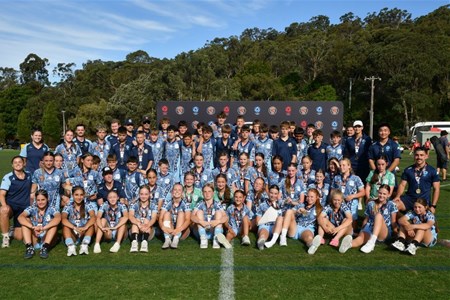 a group of football players posing for a picture