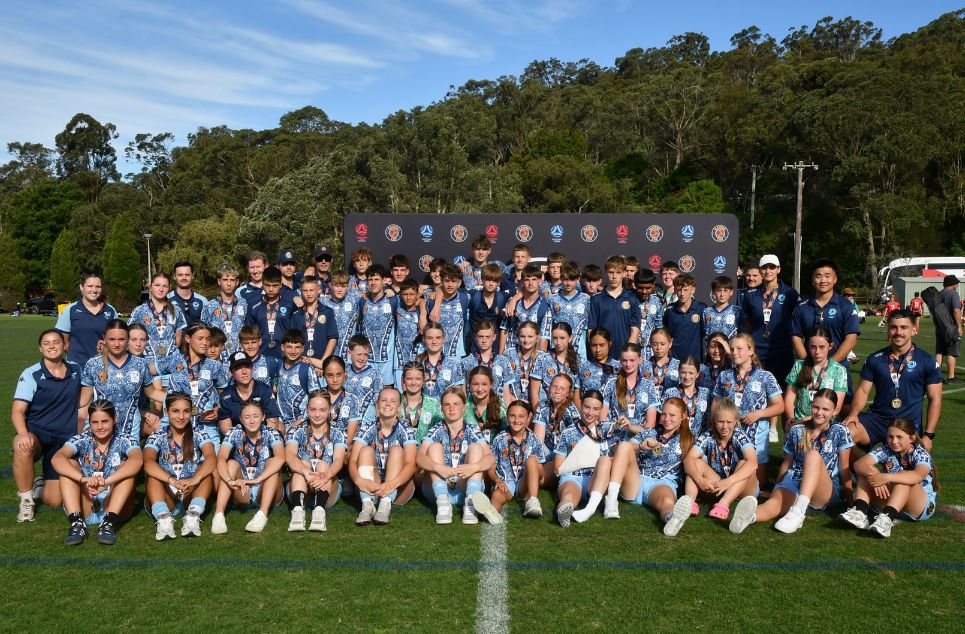 a group of football players posing for a picture