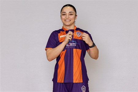 a person standing posing for the camera