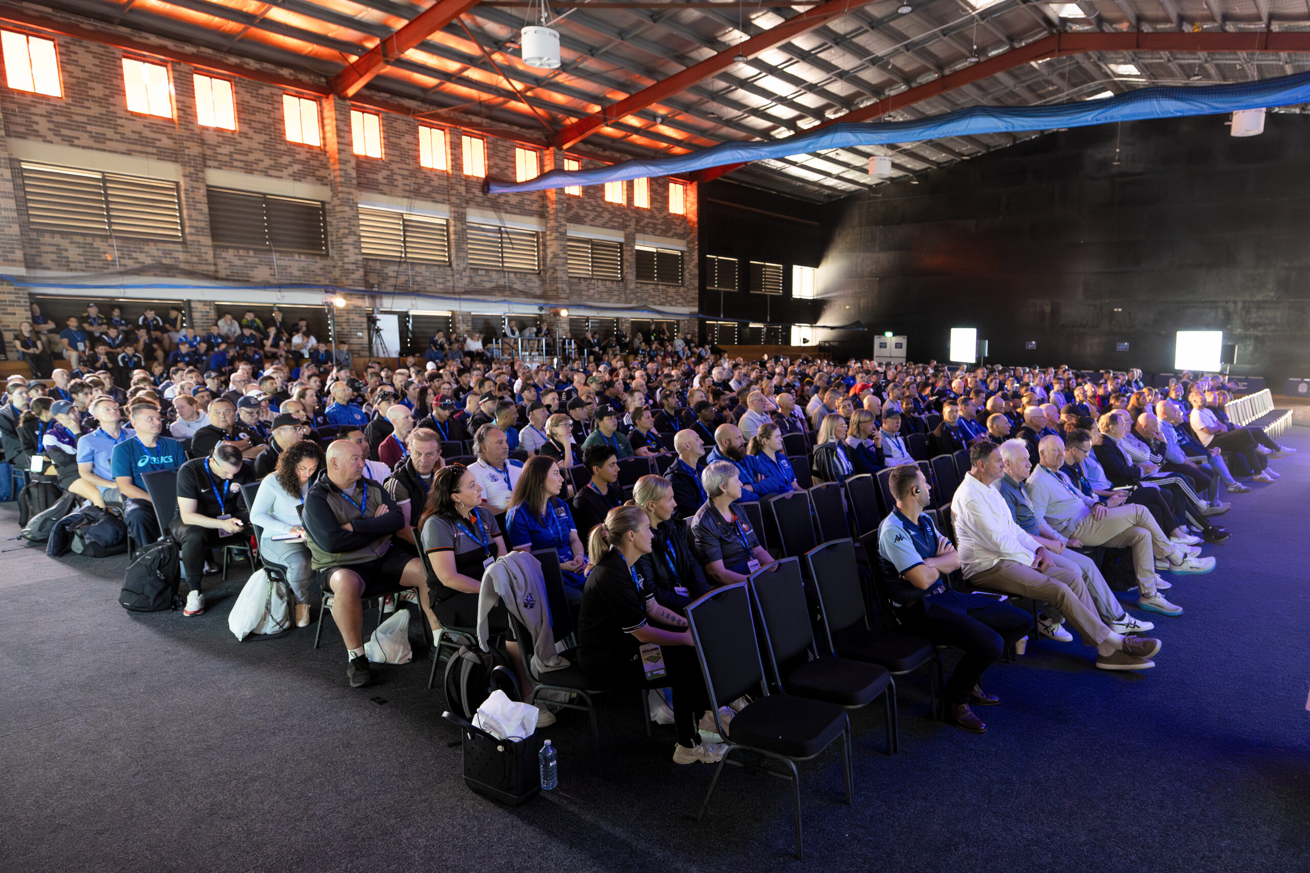 a group of people standing in front of a crowd