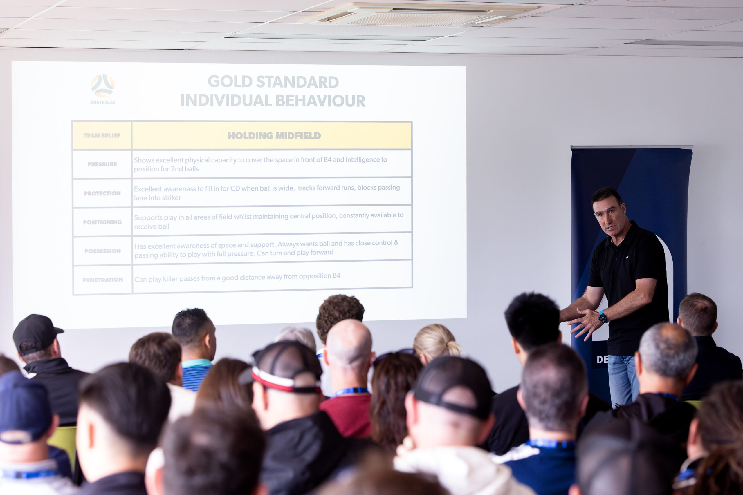 a group of people standing in front of a crowd