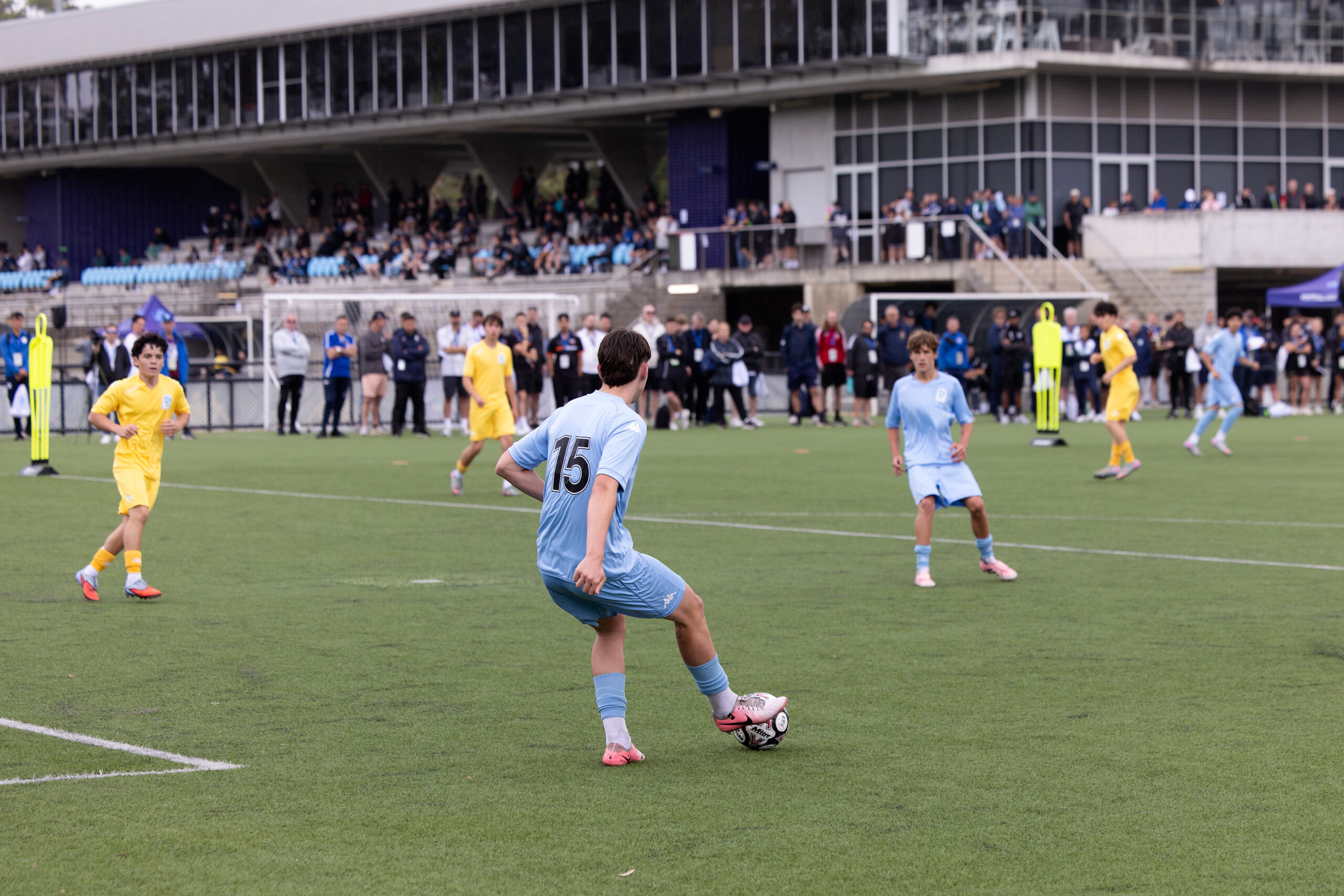 a group of people playing football on a field