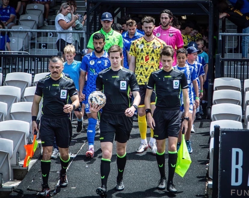 a group of football players posing for a picture