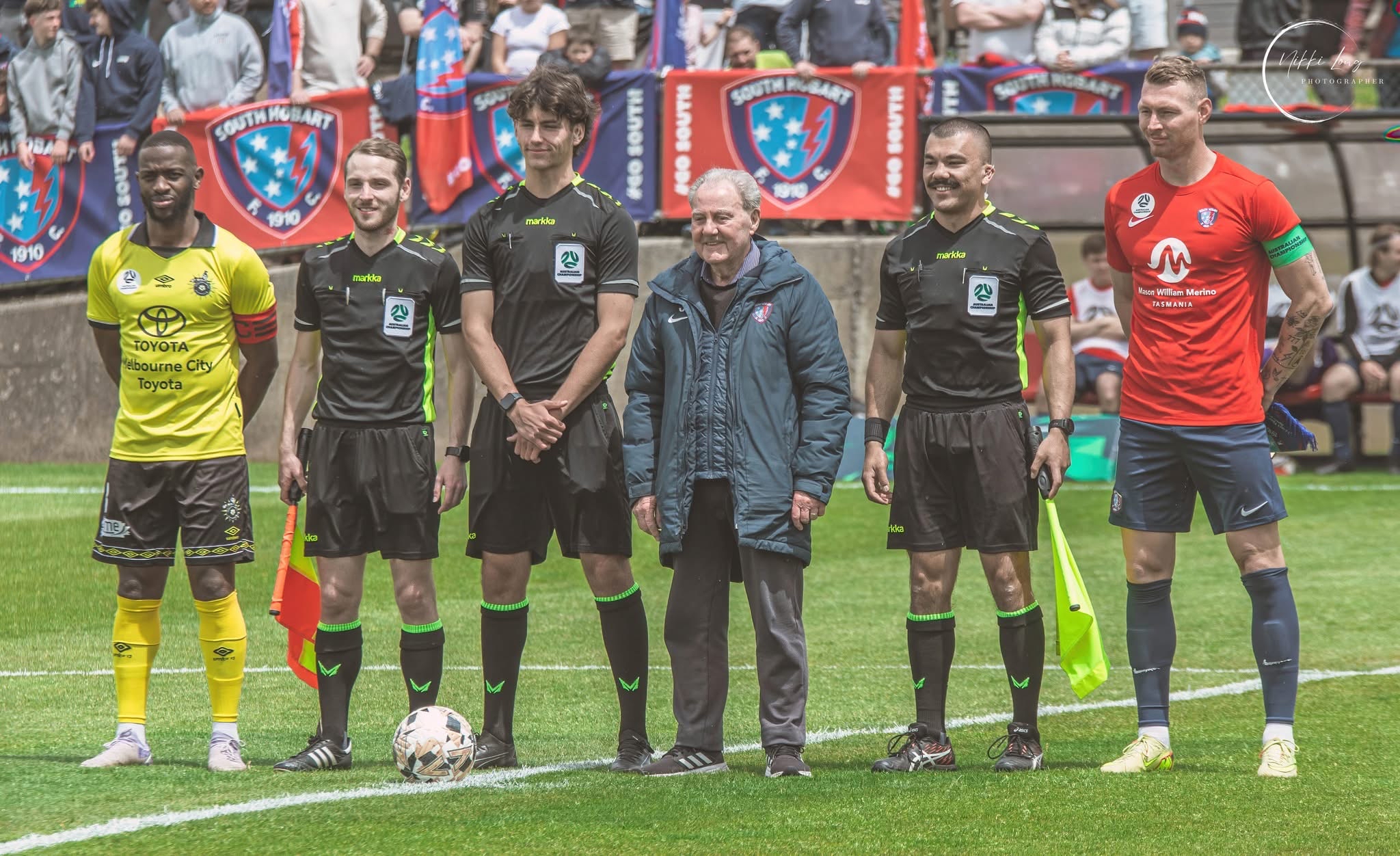 a group of people playing football on a field