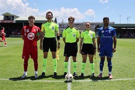 a group of people standing on a football field