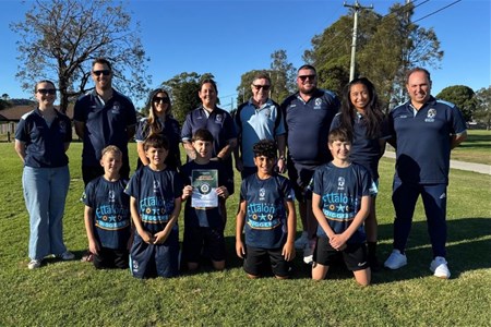 a group of people posing for a photo