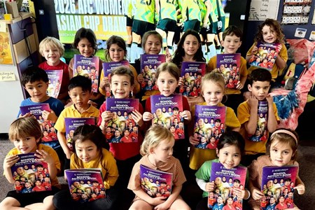 a group of kids posing for a photo