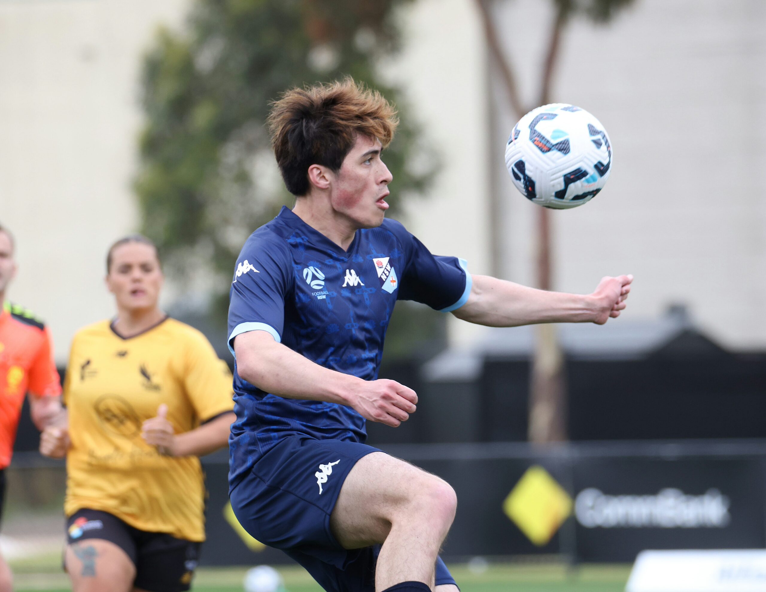 a group of young men playing a game of football