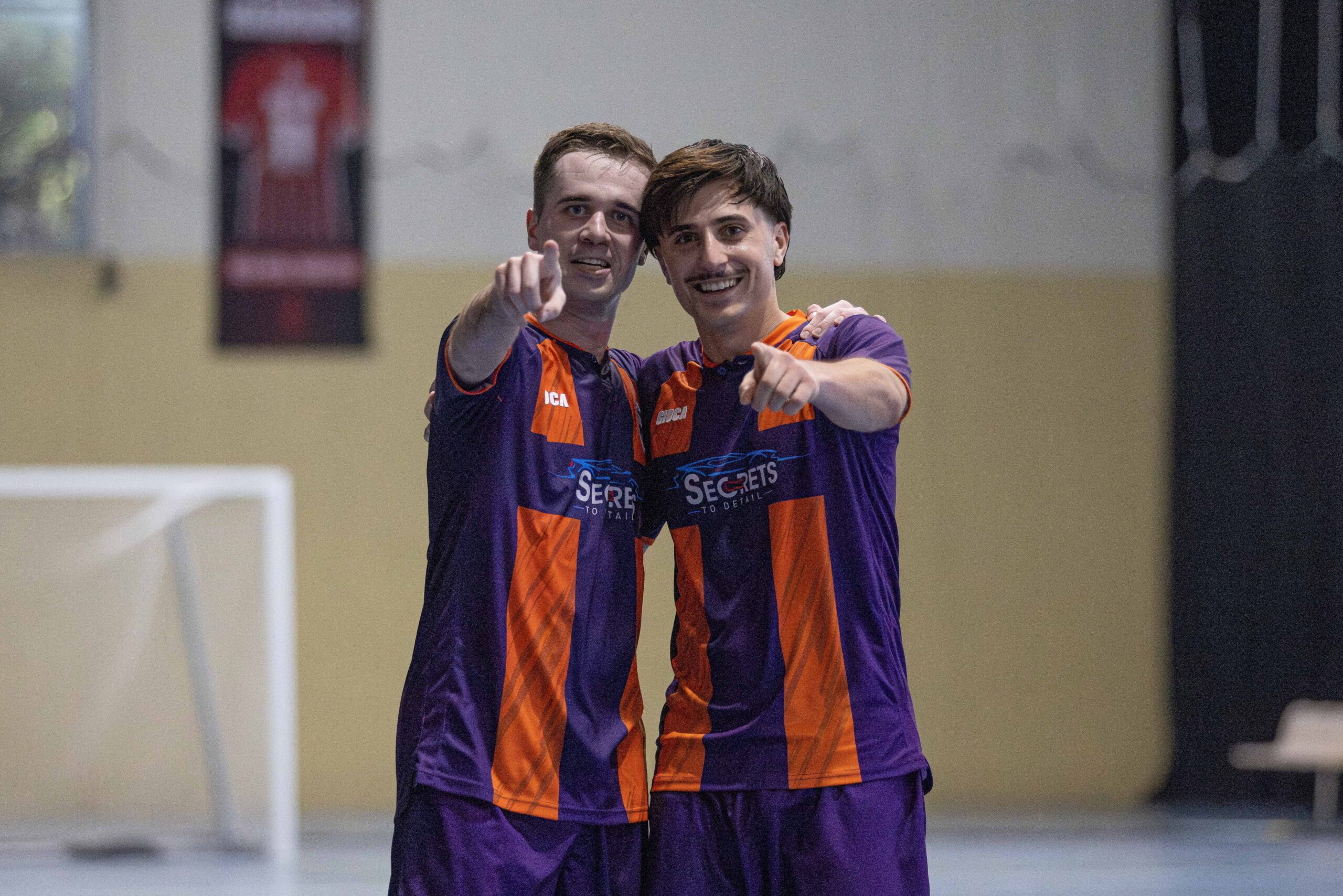a young man standing in a room