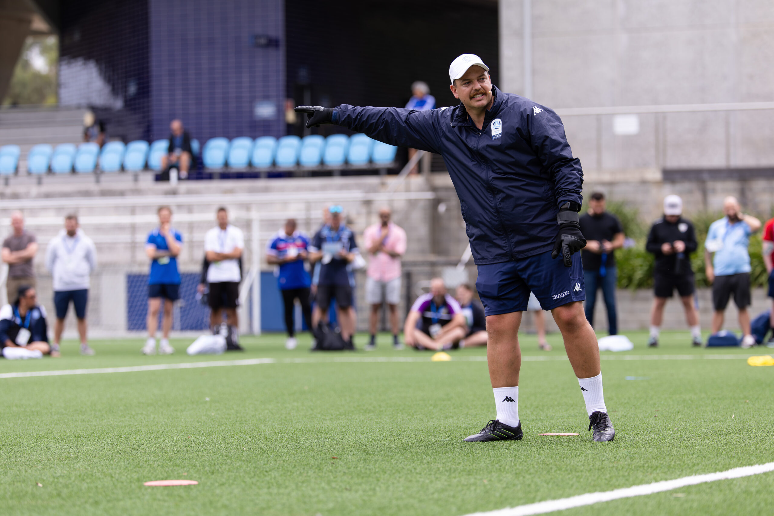 a group of people playing football on a field