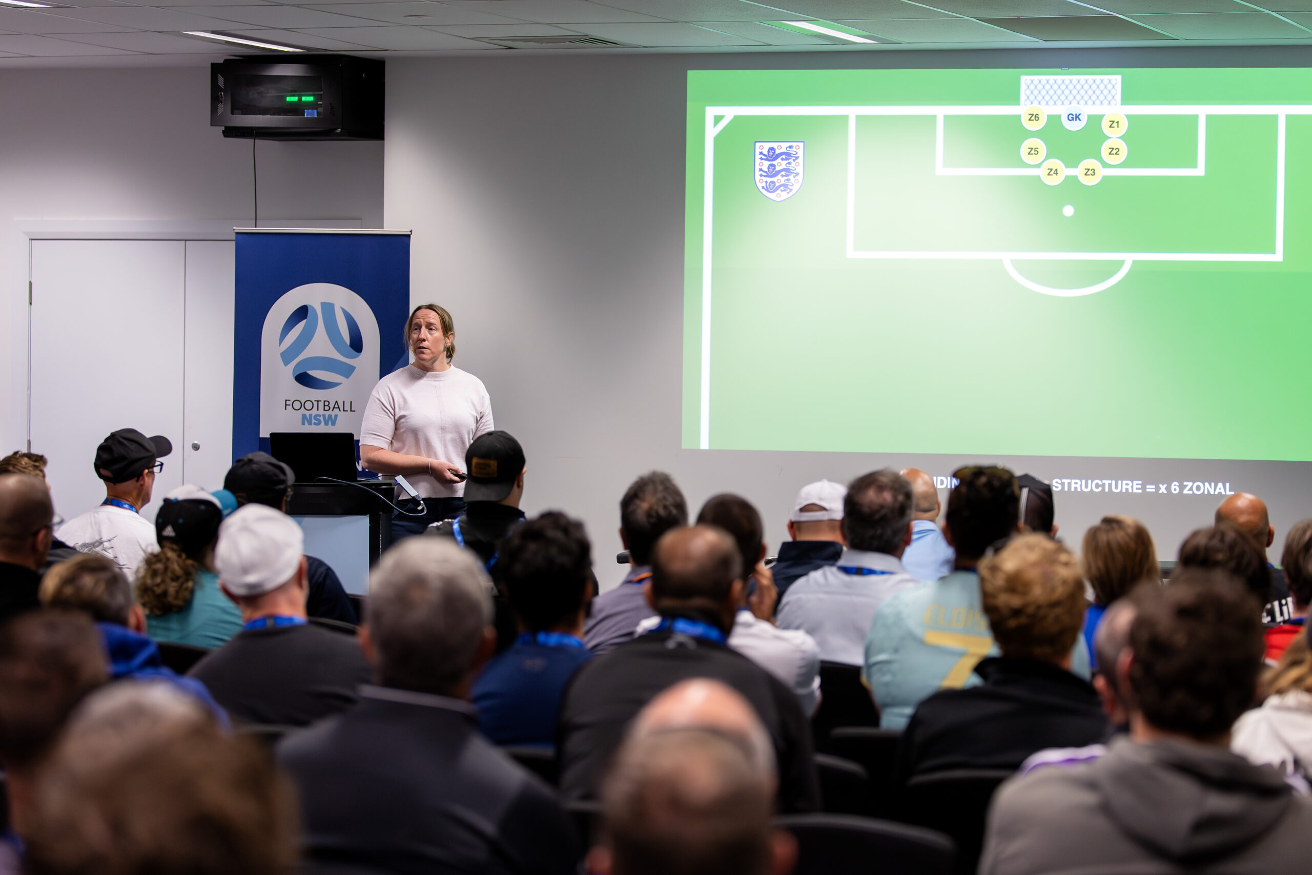 a group of people sitting in front of a crowd