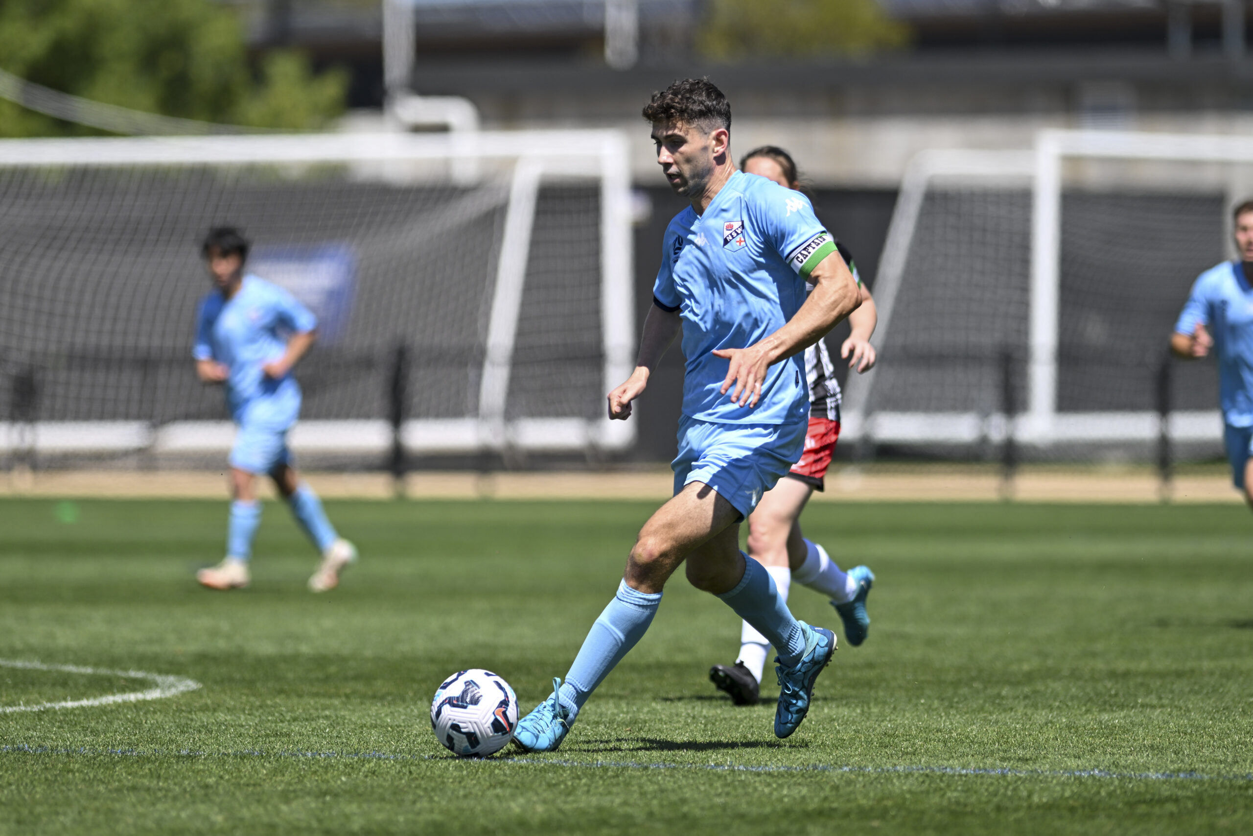 a group of young men playing a game of football