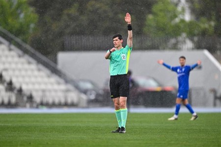 a group of young men playing a game of football