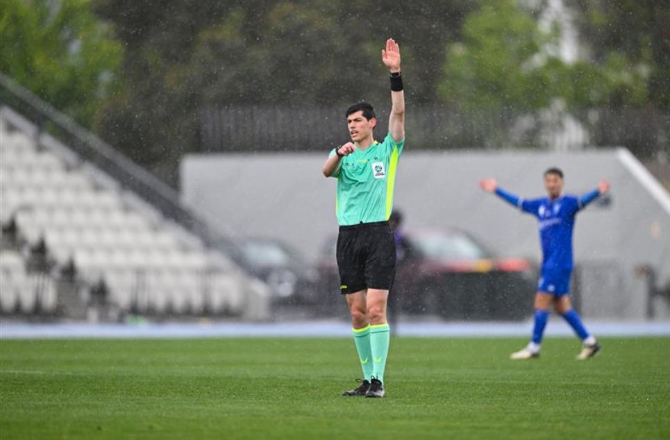 a group of young men playing a game of football