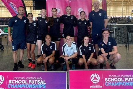 a group of people posing for a photo