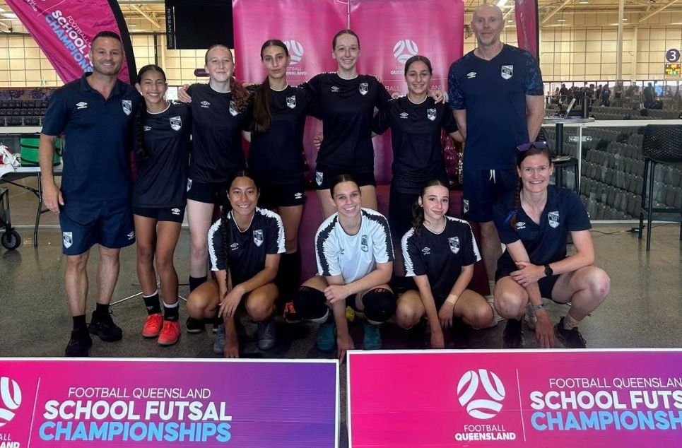 a group of people posing for a photo