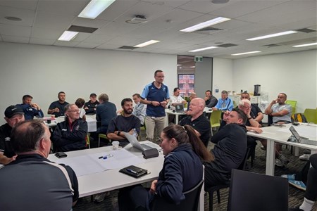 a group of people sitting at a table