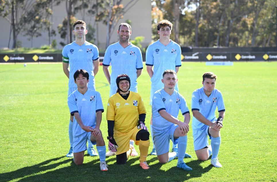 a group of young men playing a game of football