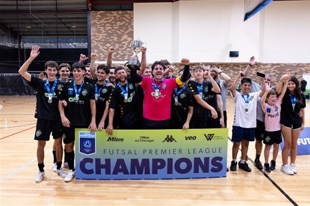 a group of people standing in front of a crowd posing for the camera