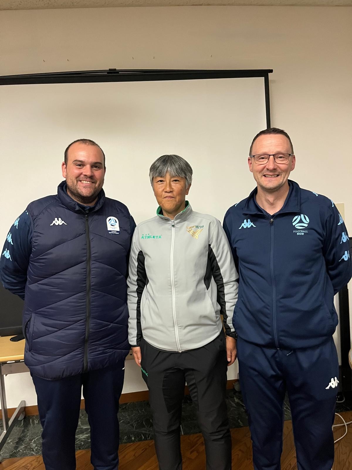 a group of people posing for a photo