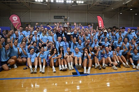 a group of people standing in front of a crowd