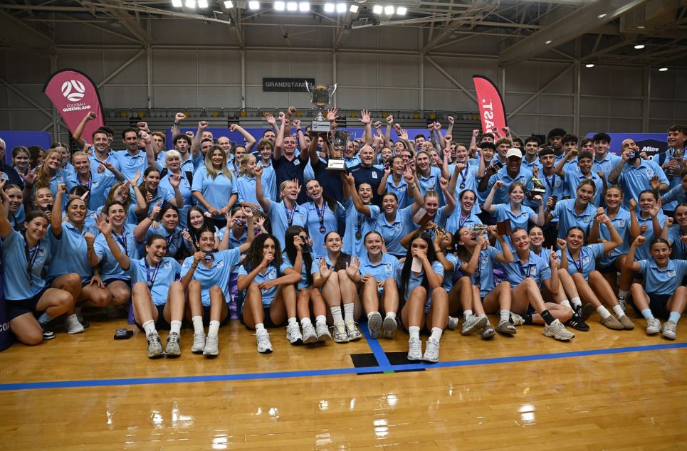 a group of people standing in front of a crowd