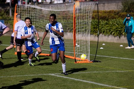 a group of young men playing a game of football