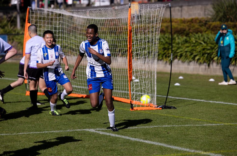 a group of young men playing a game of football