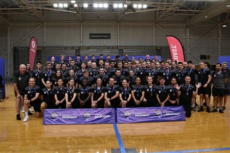 a group of people standing in front of a crowd