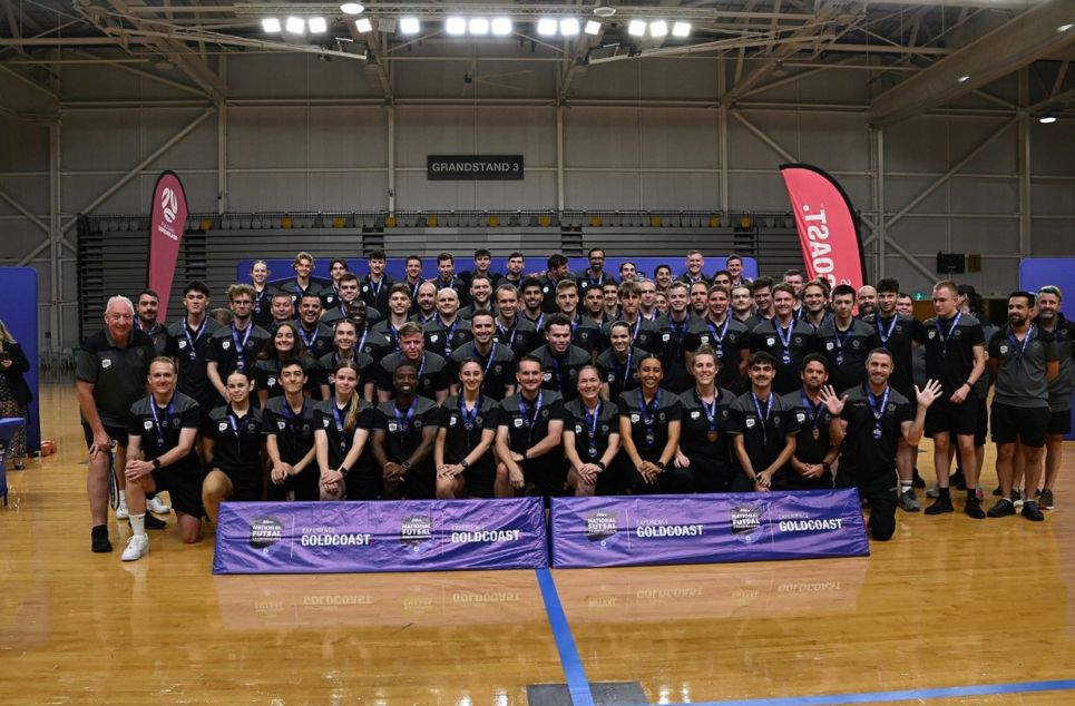 a group of people standing in front of a crowd