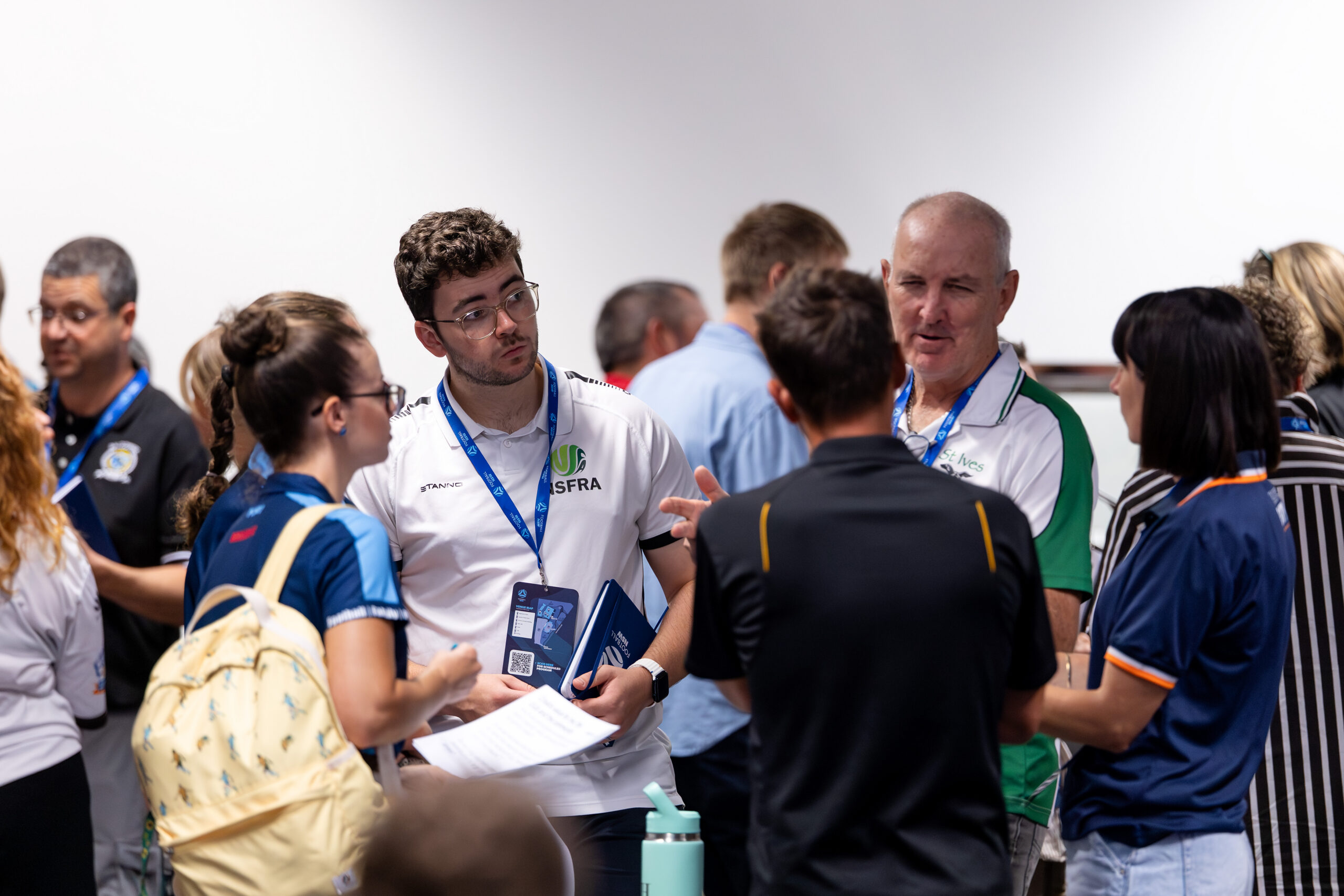 a group of people standing in front of a crowd