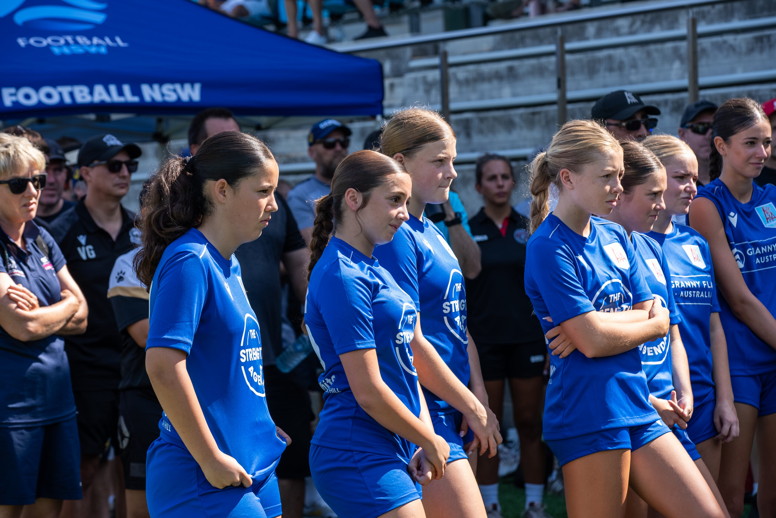 a group of people standing in front of a crowd