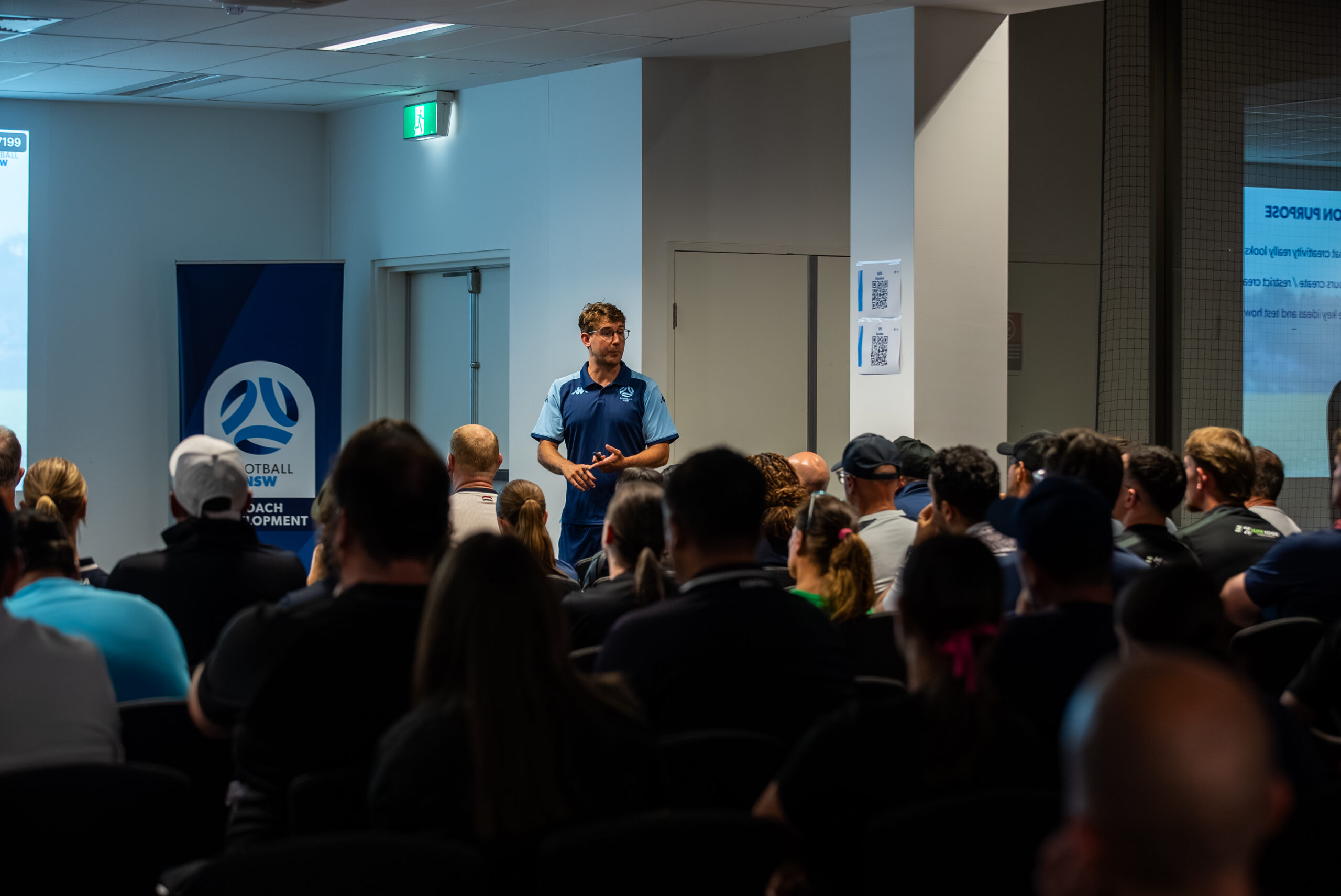 a group of people sitting in front of a crowd