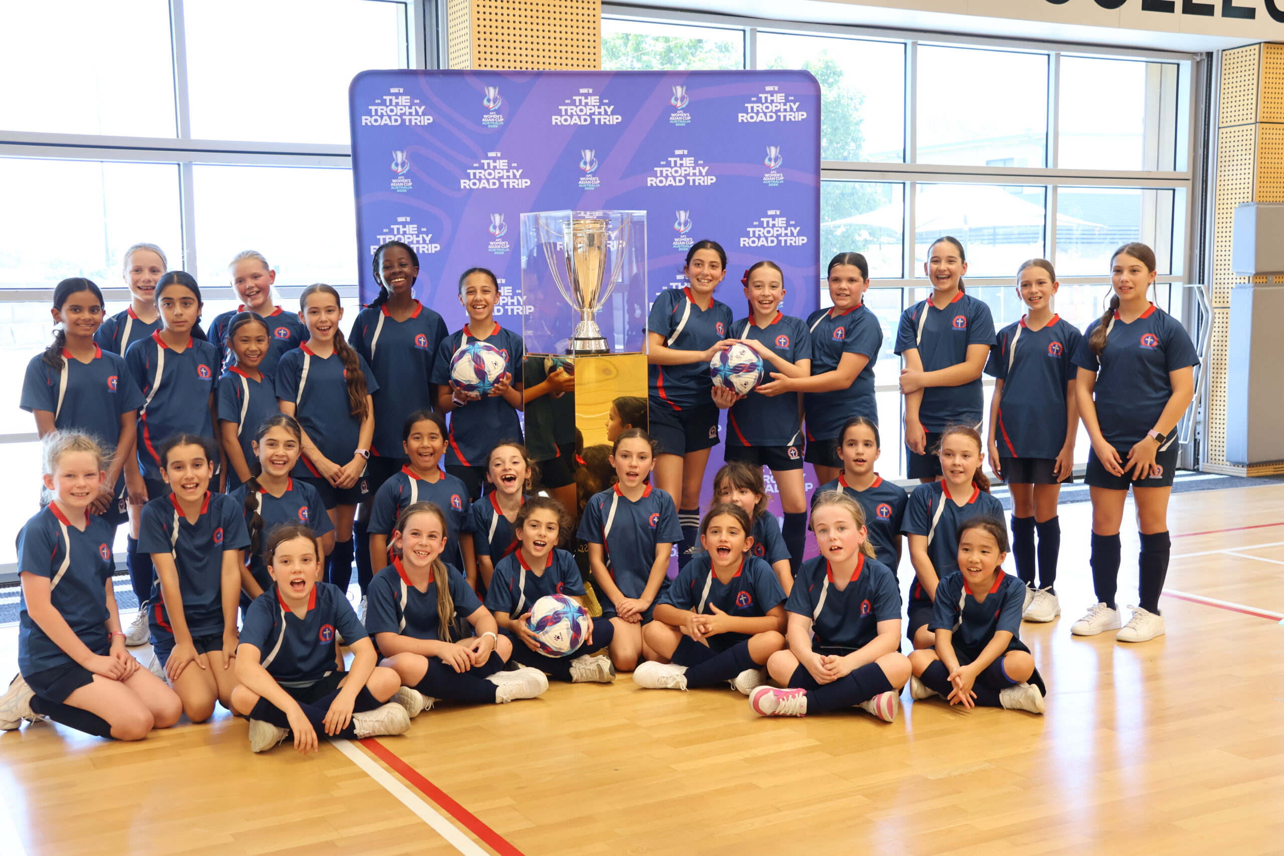 a group of people standing in front of a crowd posing for the camera