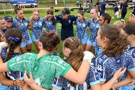 a group of people around each other