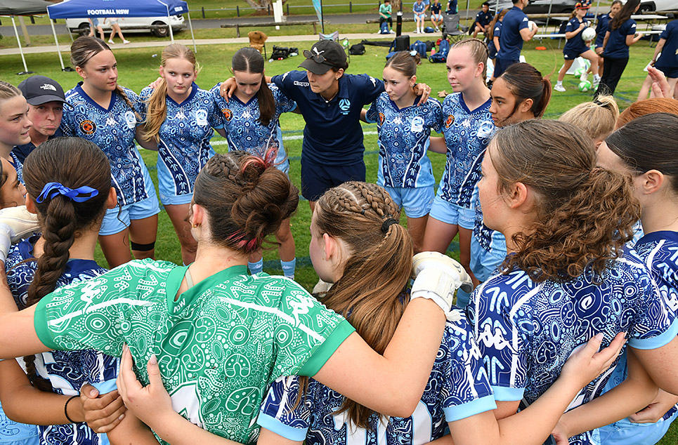 a group of people around each other