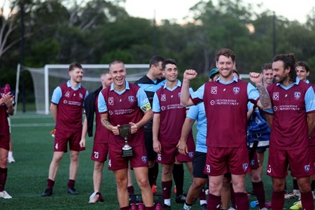 a group of football players posing for a picture