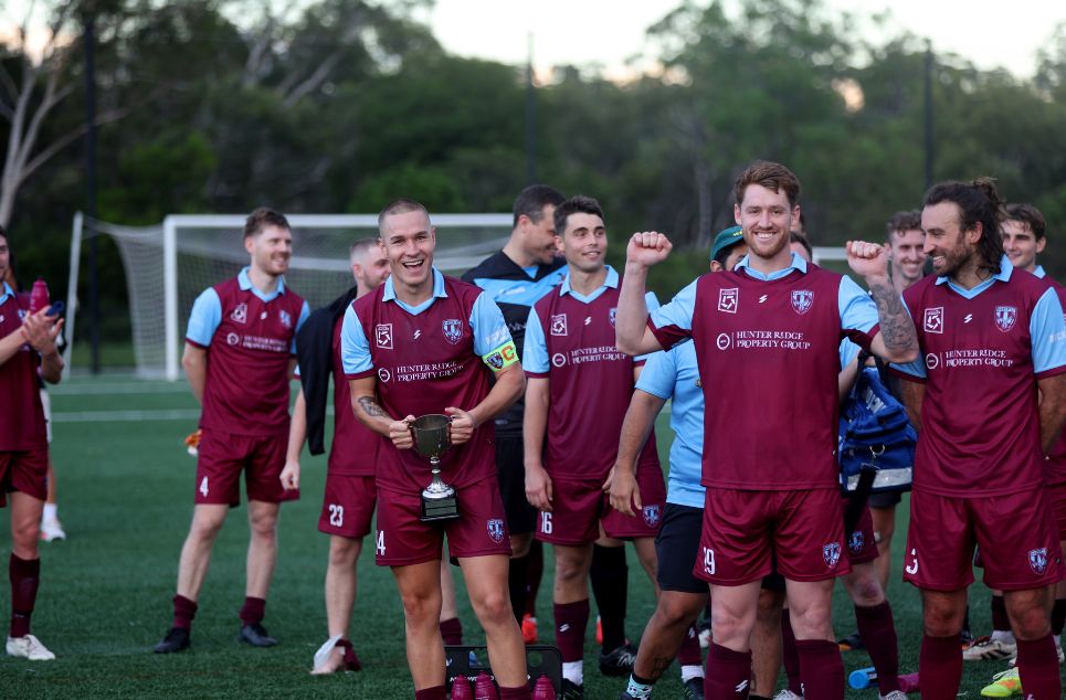 a group of football players posing for a picture