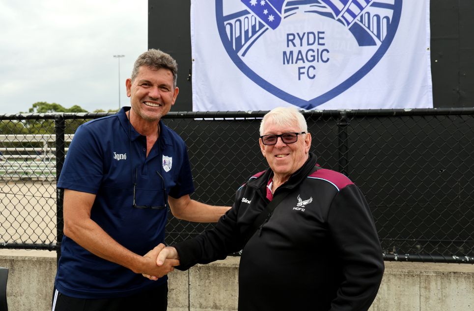 a man holding a sign posing for the camera