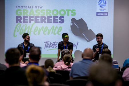 a group of people standing in front of a crowd