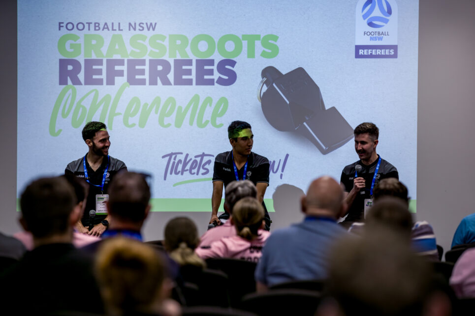 a group of people standing in front of a crowd
