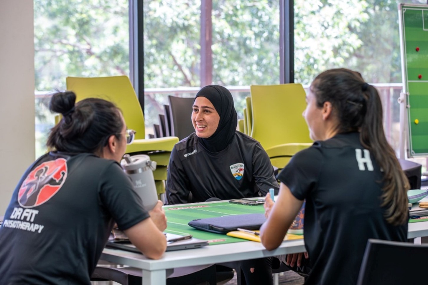 a group of people sitting at a table